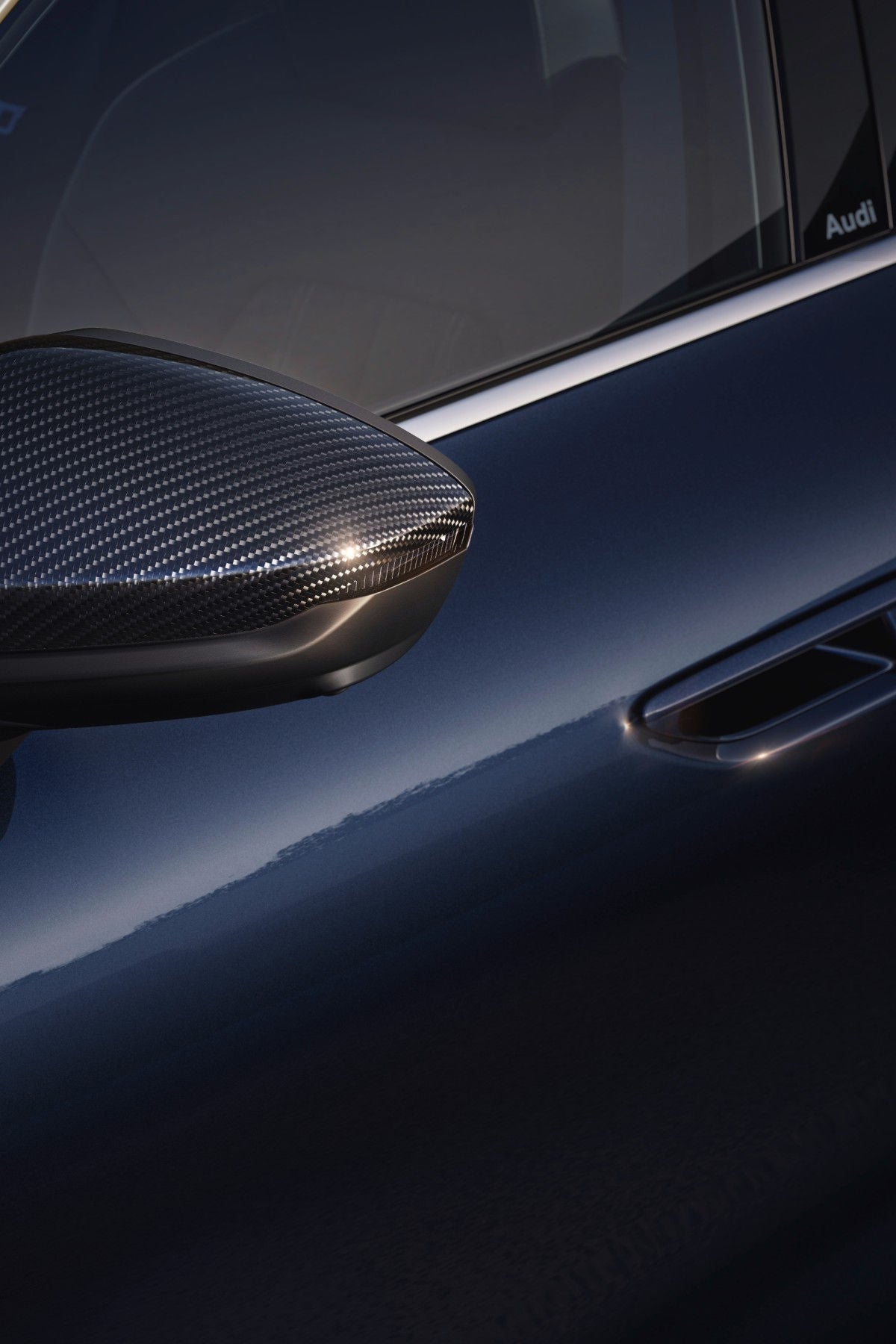 Close up of an Audi car seat, featuring the RS logo and red stiches